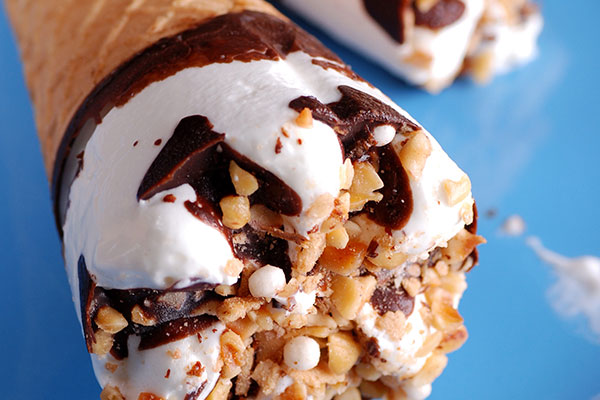 Ice cream cone with chocolate and nuts