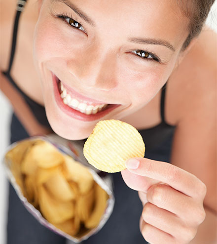 Employee eating chips for a snack